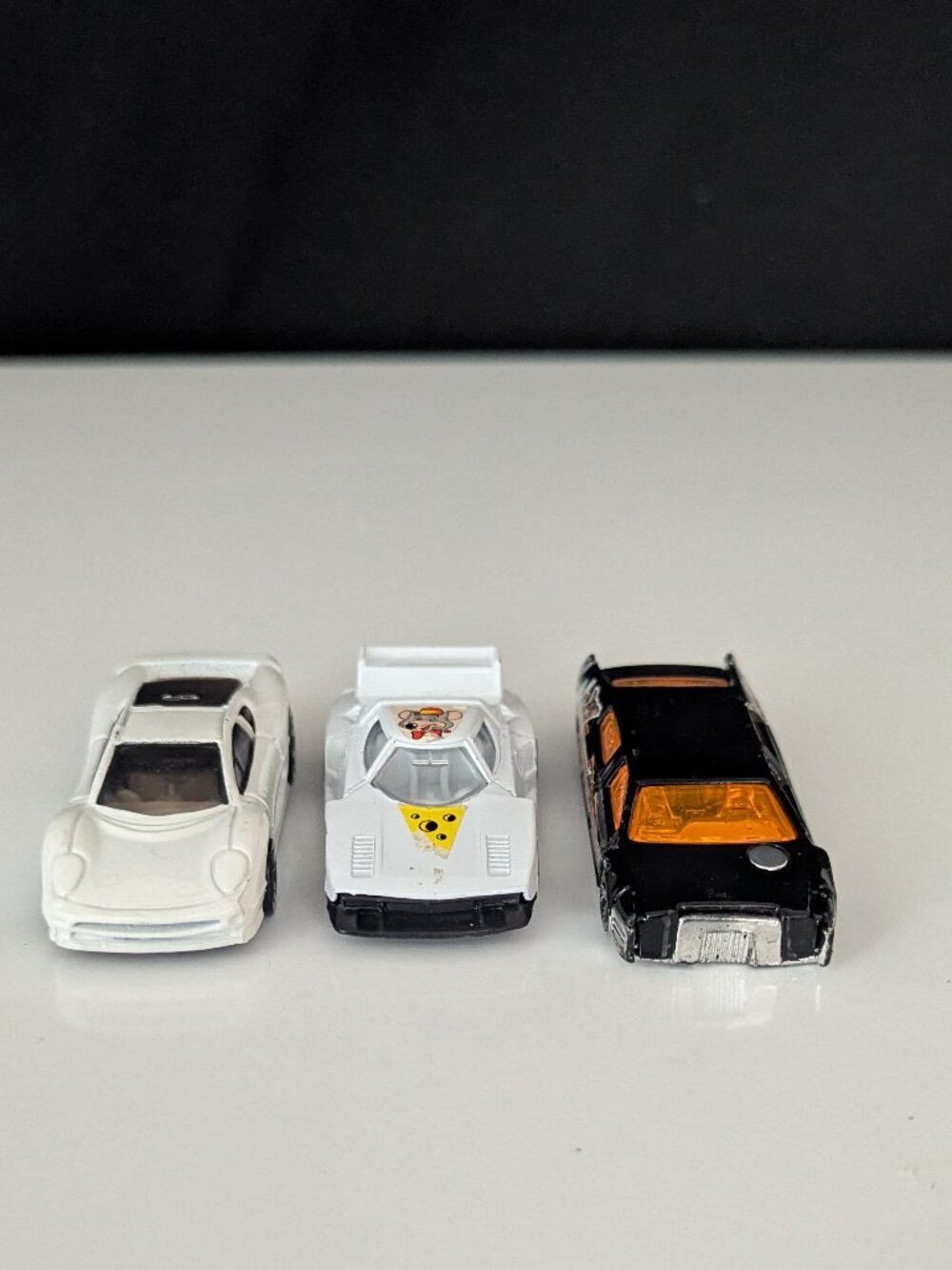 Lot of three vintage die cast cars including the Chuck E Cheese promo car